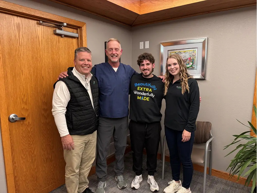 Phil Cole and Laura Bloomquist with a practice owner at a completed KLAS transition