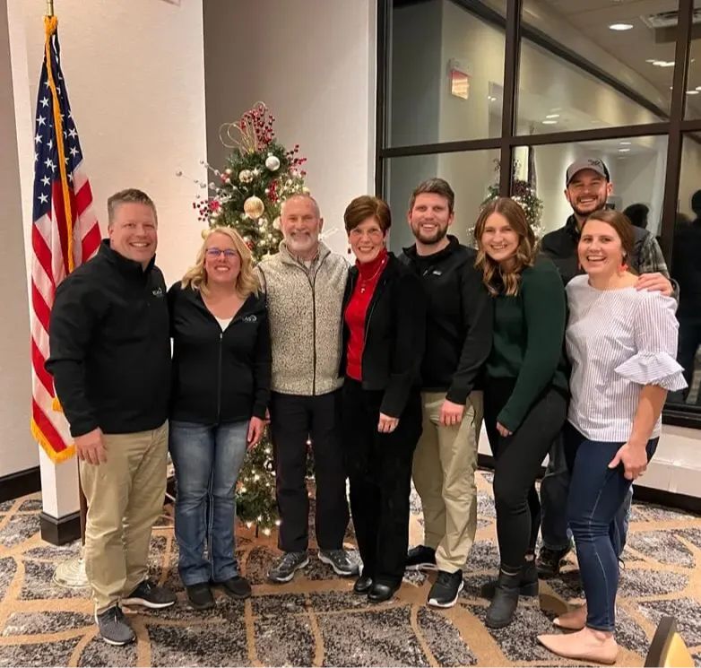 Phil Cole with a practice owner and their family after a successful KLAS transition