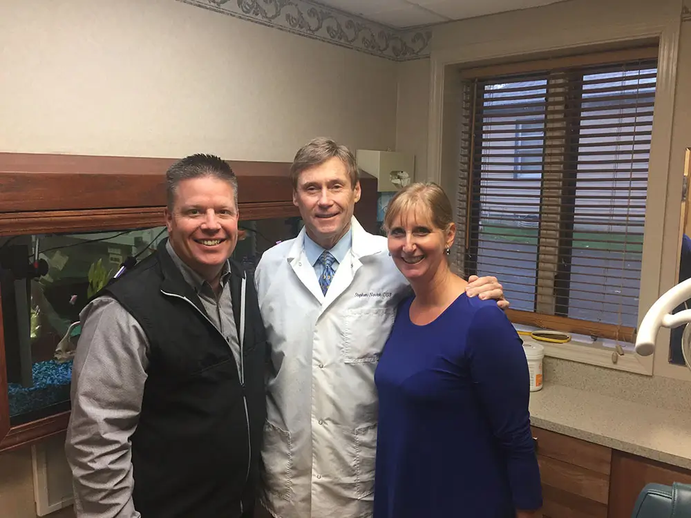 Dr. Stephen Novak with the KLAS team and family at his practice transition